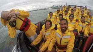 Lisa Collins and Mark Nu'u taking time out on a jet boat ride around Auckland harbour.